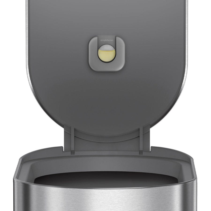 Detail view of Simplehuman Brushed Stainless Steel Step Can showing lid, liner rim, and odor-absorbing pod holder.