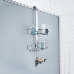 over door adjustable shower caddy - lifestyle hanging over door with props image