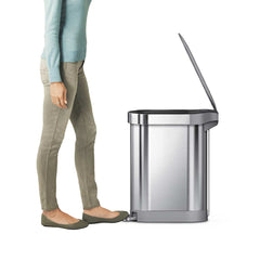 45L slim pedal bin - brushed stainless steel with plastic lid - foot stepping on pedal image