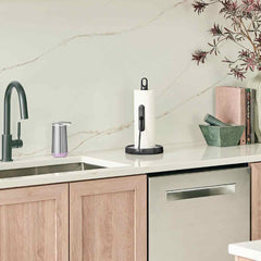 tension arm paper towel holder - black finish - lifestyle next to kitchen sink